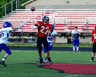 Neighbors | Submitted .Canfield Village Middle School seventh-grade quarterback Broc Lowry throws a pass against Poland. Canfield defeats Poland 26-0.