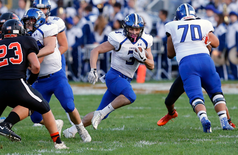 MICHAEL G TAYLOR | THE VINDICATOR- 09-15-17 FOOTBALL Poland Bulldogs vs Howland Tigers at Howland High School, Warren, OH.1st qtr., Poland's #3 Jonah Spencer breaks through the line for a long gain.