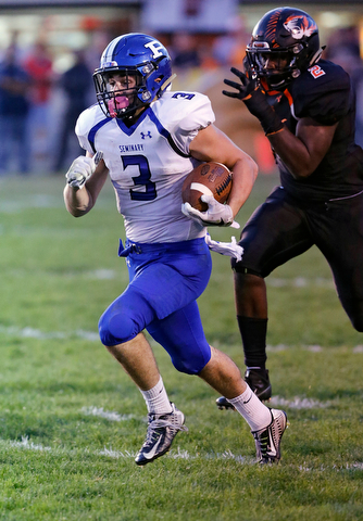 MICHAEL G TAYLOR | THE VINDICATOR- 09-15-17 FOOTBALL Poland Bulldogs vs Howland Tigers at Howland High School, Warren, OH.2nd qtr., Poland's #3 Jonah Spencer breaks free for a 83 yard TD run as Howland's #2 Chris Julian gave chase.