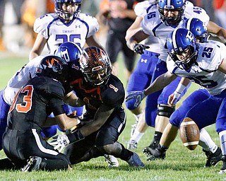 MICHAEL G TAYLOR | THE VINDICATOR- 09-15-17 FOOTBALL Poland Bulldogs vs Howland Tigers at Howland High School, Warren, OH.2nd qtr., Howland's #33 Jon Elliot fumbles the punt return as Poland's #25 M.J. Farber attempts to malke the recovery.