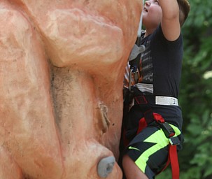 Riley Packner(8) of Boardman climbs the rock wall during the annual Outdoor Family Fun Day, Saturday, Sept. 16, 2017, at Boardman Park in Boardman...(Nikos Frazier | The Vindicator)..