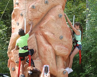 Jeremiah Jackson(6) of Youngstown and Guleighuna Parks(10) of Youngstown climb the rock wall during the annual Outdoor Family Fun Day, Saturday, Sept. 16, 2017, at Boardman Park in Boardman...(Nikos Frazier | The Vindicator)..