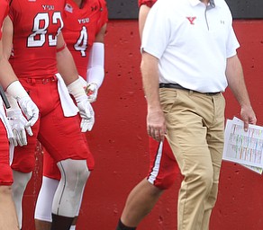 Youngstown State University head coach Bo Pelini walk onto the field before Youngstown State takes on Central Connecticut State, Saturday, Sept. 16, 2017, at Stambaugh Stadium in Youngstown. Youngstown State won 59-9...(Nikos Frazier | The Vindicator)..