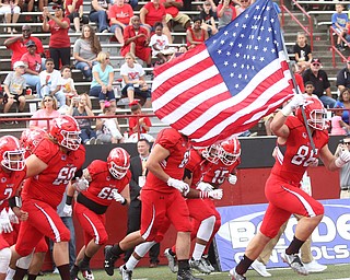 Youngstown State University tight end Shane Kuhn (86) leads the Penguins onto the field before taking on Central Connecticut State, Saturday, Sept. 16, 2017, at Stambaugh Stadium in Youngstown. Youngstown State won 59-9...(Nikos Frazier | The Vindicator)..
