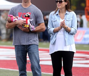 Tommie Zetts(left) stands with his wife, Brittany and newborn daughter, Mariella(4 days old) as he is inducted into the Youngstown State University Athletics Hall of Fame in the first quarter as Youngstown State takes on Central Connecticut State, Saturday, Sept. 16, 2017, at Stambaugh Stadium in Youngstown. Youngstown State won 59-9...(Nikos Frazier | The Vindicator)..
