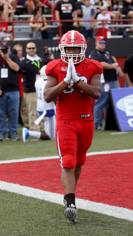 Youngstown State University tail back Tevin McCaster (37) places his hands together after scoring a touchdown in the first quarter as Youngstown State takes on Central Connecticut State, Saturday, Sept. 16, 2017, at Stambaugh Stadium in Youngstown. Youngstown State won 59-9...(Nikos Frazier | The Vindicator)..