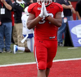Youngstown State University tail back Tevin McCaster (37) places his hands together after scoring a touchdown in the first quarter as Youngstown State takes on Central Connecticut State, Saturday, Sept. 16, 2017, at Stambaugh Stadium in Youngstown. Youngstown State won 59-9...(Nikos Frazier | The Vindicator)..