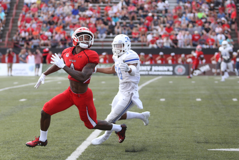 Youngstown State University wide receiver Damoun Patterson (4) looks up for the ball as Central Connecticut State University Blue Devils cornerback Darryn Horner (30) closes in in the first quarter as Youngstown State takes on Central Connecticut State, Saturday, Sept. 16, 2017, at Stambaugh Stadium in Youngstown. Youngstown State won 59-9...(Nikos Frazier | The Vindicator)..