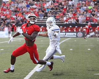 Youngstown State University wide receiver Damoun Patterson (4) looks up for the ball as Central Connecticut State University Blue Devils cornerback Darryn Horner (30) closes in in the first quarter as Youngstown State takes on Central Connecticut State, Saturday, Sept. 16, 2017, at Stambaugh Stadium in Youngstown. Youngstown State won 59-9...(Nikos Frazier | The Vindicator)..