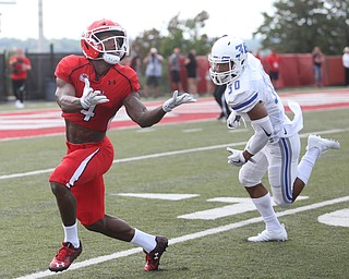 Youngstown State University wide receiver Damoun Patterson (4) looks up for the ball as Central Connecticut State University Blue Devils cornerback Darryn Horner (30) closes in in the first quarter as Youngstown State takes on Central Connecticut State, Saturday, Sept. 16, 2017, at Stambaugh Stadium in Youngstown. Youngstown State won 59-9...(Nikos Frazier | The Vindicator)..