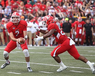 Youngstown State University quarterback Nathan Mays (7) hands off to Youngstown State University tail back Christian Turner (20) in the first quarter as Youngstown State takes on Central Connecticut State, Saturday, Sept. 16, 2017, at Stambaugh Stadium in Youngstown. Youngstown State won 59-9...(Nikos Frazier | The Vindicator)..