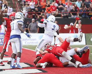 Youngstown State University tail back Christian Turner (20) rolls into the end zone for a touchdown in the first quarter as Youngstown State takes on Central Connecticut State, Saturday, Sept. 16, 2017, at Stambaugh Stadium in Youngstown. Youngstown State won 59-9...(Nikos Frazier | The Vindicator)..