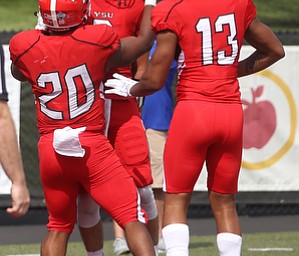 Youngstown State University quarterback Nathan Mays (7)(Center) celebrates with Youngstown State University tail back Christian Turner (20) and Youngstown State University wide receiver Stefan Derrick II (13) after Mays scored a touchdown in the second quarter as Youngstown State takes on Central Connecticut State, Saturday, Sept. 16, 2017, at Stambaugh Stadium in Youngstown. Youngstown State won 59-9...(Nikos Frazier | The Vindicator)..