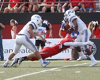 Central Connecticut State University Blue Devils defensive back Tajik Bagley (23) is taken down by Youngstown State University safety Sam McGuigan (43) as Central Connecticut State University Blue Devils linebacker Troy Vasilescu (55) watches on in the second quarter as Youngstown State takes on Central Connecticut State, Saturday, Sept. 16, 2017, at Stambaugh Stadium in Youngstown. Youngstown State won 59-9...(Nikos Frazier | The Vindicator)..