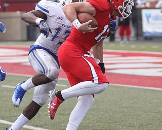 Youngstown State University wide receiver Ricky Davis (12) runs into the end zone as Central Connecticut State University Blue Devils safety Najae Brown (13) tries to stop the touchdown in the third quarter as Youngstown State takes on Central Connecticut State, Saturday, Sept. 16, 2017, at Stambaugh Stadium in Youngstown. Youngstown State won 59-9...(Nikos Frazier | The Vindicator)..