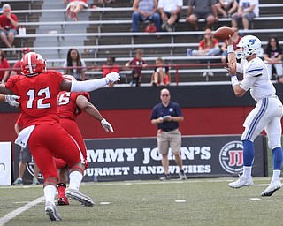 Youngstown State University defensive end Ma'lik Richmond (12) makes a run for Central Connecticut State University Blue Devils quarterback Jacob Dolegala (9) in the third quarter as Youngstown State takes on Central Connecticut State, Saturday, Sept. 16, 2017, at Stambaugh Stadium in Youngstown. Youngstown State won 59-9...(Nikos Frazier | The Vindicator)..