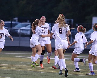 Austintown Fitch's Jordan Evans (23) celebrates with her teammates after she scored the first goal of the game during the first half of Monday night's matchup against Canfield at Fitch High School.   Dustin Livesay  |  The Vindicator  9/18/17  Fitch.