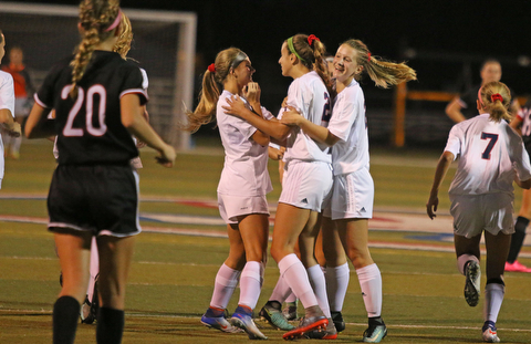 Austintown Fitch's Lauren Dolak (21,middle) celebrates with her teammates after scoring a goal in the first half to take a 2-0 lead over Canfield on Monday night at Fitch High School.   Dustin Livesay  |  The Vindicator  9/18/17  Fitch.