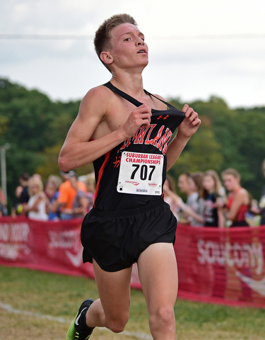 Howland's Vincent Mauri celebrates as he crosses the finish line to win the 2017 Suburban League Championship, Tuesday afternoon at the Canfield Fair Grounds. DAVID DERMER | THE VINDICATOR