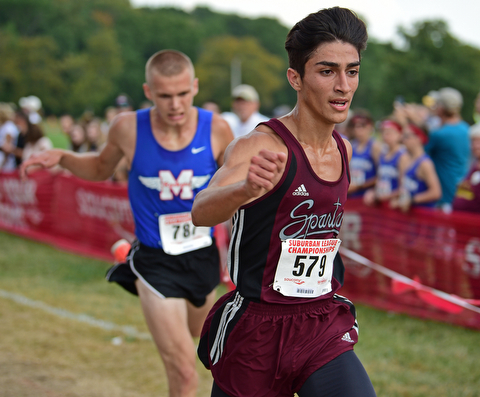 Boardman's Mark Moradian crosses the finish line head of Maplewood's Adam Burgard during the 2017 Suburban League Championship, Tuesday afternoon at the Canfield Fair Grounds. Moradian would finish 14th and Burgard would finish 15th. DAVID DERMER | THE VINDICATOR