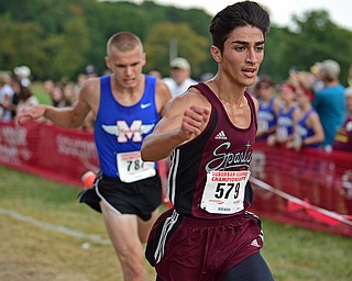 Boardman's Mark Moradian crosses the finish line head of Maplewood's Adam Burgard during the 2017 Suburban League Championship, Tuesday afternoon at the Canfield Fair Grounds. Moradian would finish 14th and Burgard would finish 15th. DAVID DERMER | THE VINDICATOR