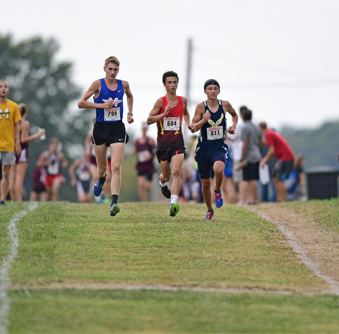 Maplewood's Ethan Sparks, Canfield's Giovanni Copploe and McDonald's Ethan Domitrovich sprint together down the back stretch during the 2017 Suburban League Championship, Tuesday afternoon at the Canfield Fair Grounds. DAVID DERMER | THE VINDICATOR