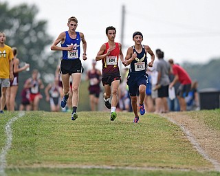 Maplewood's Ethan Sparks, Canfield's Giovanni Copploe and McDonald's Ethan Domitrovich sprint together down the back stretch during the 2017 Suburban League Championship, Tuesday afternoon at the Canfield Fair Grounds. DAVID DERMER | THE VINDICATOR