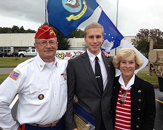 Seth Welch, a senior at Austintown Fitch High School, was among those recognized and honored for supporting U.S. military veteran causes at the recent 11th annual Patriots Day event outside Quaker Steak and Lube in Austintown. Welch was the driving force behind the construction of a veterans memorial in front of the high school. Others supporting the event included the Fitch High School choir and Marc Pupino, Fitch High School principal, who performed taps. Thirteen people were honored for their courage and service commitment to country as attendees memorialized the Sept. 11, 2001, terrorist attacks. Above, from left, are Ken Jakubec, Austintown school board member and event coordinator; Welch; and Kathy Mock, Austintown school board vice president. 