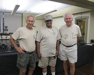 Neighbors | Alexis Bartolomucci.Members of the Riverside Railroad Club set up model trains at the Boardman library for guests to interact with on Aug. 4 and 5. Pictured, from left, are Mike Zador, Danny Houston and Horst Klintz.