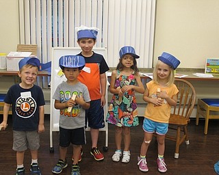 Neighbors | Alexis Bartolomucci.Children wore conductor hats and blew whistles that they received at the Trains! Trains! Trains! story time on Aug. 4 at the Boardman library.
