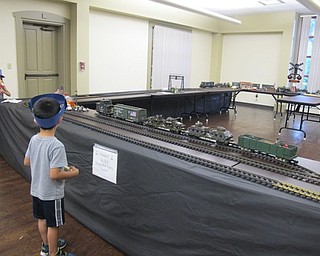Neighbors | Alexis Bartolomucci.Trains moved along the tracks at the Boardman library on Aug. 4 and 5 as children watched in their conductor hats they made at story time.