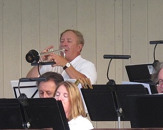 Neighbors | Zack Shively  .Glass City Swing Band's Don Stoner took the trumpet solo in Glenn Miller's "Tuxedo Junction" at Music in the Park at Boardman Park on Aug. 10.