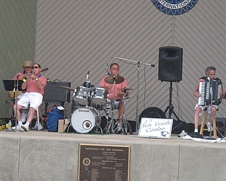 Neighbors | Zack Shively  .The Jim Frank Combo opened their show at Austintown Park on Aug. 16 with a fast tune full of solos. Pictured, from left, are Joe Commarata, Paul Jacobson, Bill Gonda and Jim Frank.