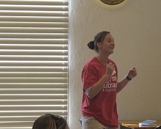 Neighbors | Zack Shively  .Austintown librarian Allison Graf got the children to dance and sing-along to "Five Little Monkeys" at the library's Gotta Move Story Time on Aug. 17.