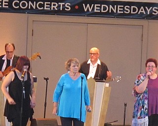 Neighbors | Zack Shively  .Singers, pictured, from left, Natallie Sprouse, Maureen Collins and Colleen Chance sang at the Judge Morley Pavilion on Aug. 16 in Mill Creek. This concert was the final of the summer for the Live! at the Morley events.