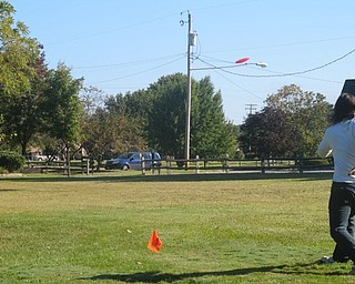 Neighbors | Zack Shively  .A player attempted a long distance throw during the Discraft Ace Race at Boardman Park on Sept. 9. The players had not used the discs prior to the Ace Race as all the discs a prototypes provided by Discraft.