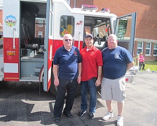Neighbors | Zack Shively  .Local firemen met with the Poland community at Poland United Methodist Church's Family Fun Carnival. Pictured are, from left, Bill O'Hara, the fire prevention officer, John Walsh, fire lieutenant, and Scott O'Hara, firefighter.
