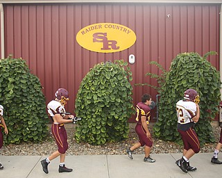 Team members walk towards the practice field, Tuesday, Sept. 19, 2017, at South Range High School in Canfield. ..(Nikos Frazier | The Vindicator)
