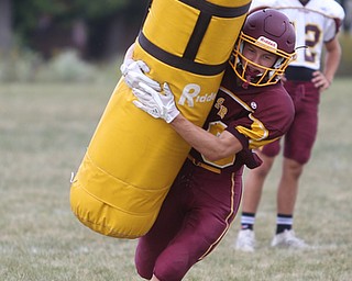 South Range wide receiver Mathias Combs (18) tackles a dummy during a weekday practice, Tuesday, Sept. 19, 2017, at South Range High School in Canfield. ..(Nikos Frazier | The Vindicator)