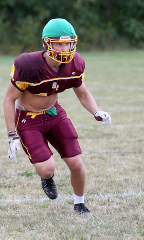 South Range quarterback Aniello Buzzacco (14) looks for an opening to try to sack the quarterback during a weekday practice, Tuesday, Sept. 19, 2017, at South Range High School in Canfield. ..(Nikos Frazier | The Vindicator)