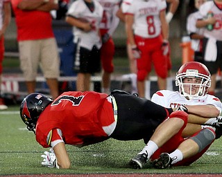 Canfield wide receiver Matt Zaremski(7) is taken down by Struthers defensive back Tommy Kopnicky(3) in the first half as Struthers takes on Canfield, Friday, Sept. 22, 2017, at Canfield High School in Canfield. ..(Nikos Frazier | The Vindicator)..