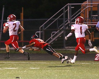 Struthers running back Nick Adams(2) returns the 99 yard kick return touchdown in the first half as Struthers takes on Canfield, Friday, Sept. 22, 2017, at Canfield High School in Canfield. Canfield defensive back Satyam Patel(17) attempts to bring him down...(Nikos Frazier | The Vindicator)..