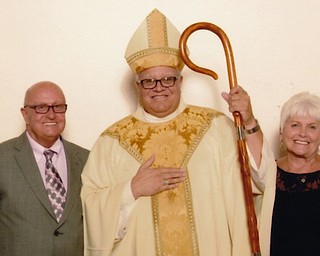Mr. and Mrs. Tony Krukowski were among couples who renewed their wedding vows in June at St. Columba Cathedral with Bishop George V. Murry, center, officiating.