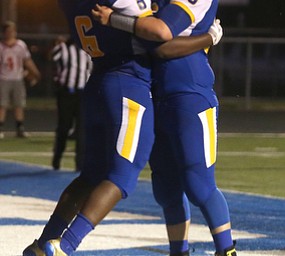Valley Christian running back Tre'Von Clay(6) celebrates his touchdown with Valley Chrisitan offensive lineman Faivd Hatfield(66) in the first half Valley Christian takes on Cochranton, Saturday, Sept. 23, 2017, at Poland High School in Poland...(Nikos Frazier | The Vindicator)..