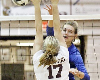 William D. Lewis The Vindicator Hubbard's Adria Powell(6) spikes a shot past Boardman's Haannah Nawrocki(17) during 9-26-17 action at Boardman.