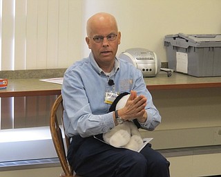 Neighbors | Zack Shively  .Librarian John Yingling sang "Giddy-Up, Horsey," complete with hand claps, at Bonding with Babies and Books at the Boardman library on Aug. 8.
