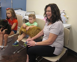 Neighbors | Zack Shively.Children listened to a story at the Boardman library's Bonding with Babies and Books on Aug. 8.