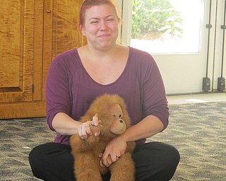Neighbors | Zack Shively  .Librarian Mallory Wiand sang "The Wheels on the Bus" to children at Bonding with Babies on Aug. 15 at the Austintown library.