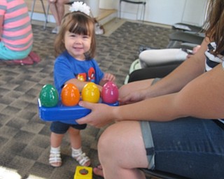 Neighbors | Zack Shively  .A child played with toys at Austintown library's Bonding with Babies on Aug. 15.