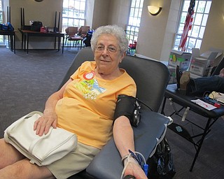 Neighbors | Zack Shively  .Lee Sheridan prepared to give at the Red Cross Blood Drive at the Poland library on Aug. 17.
